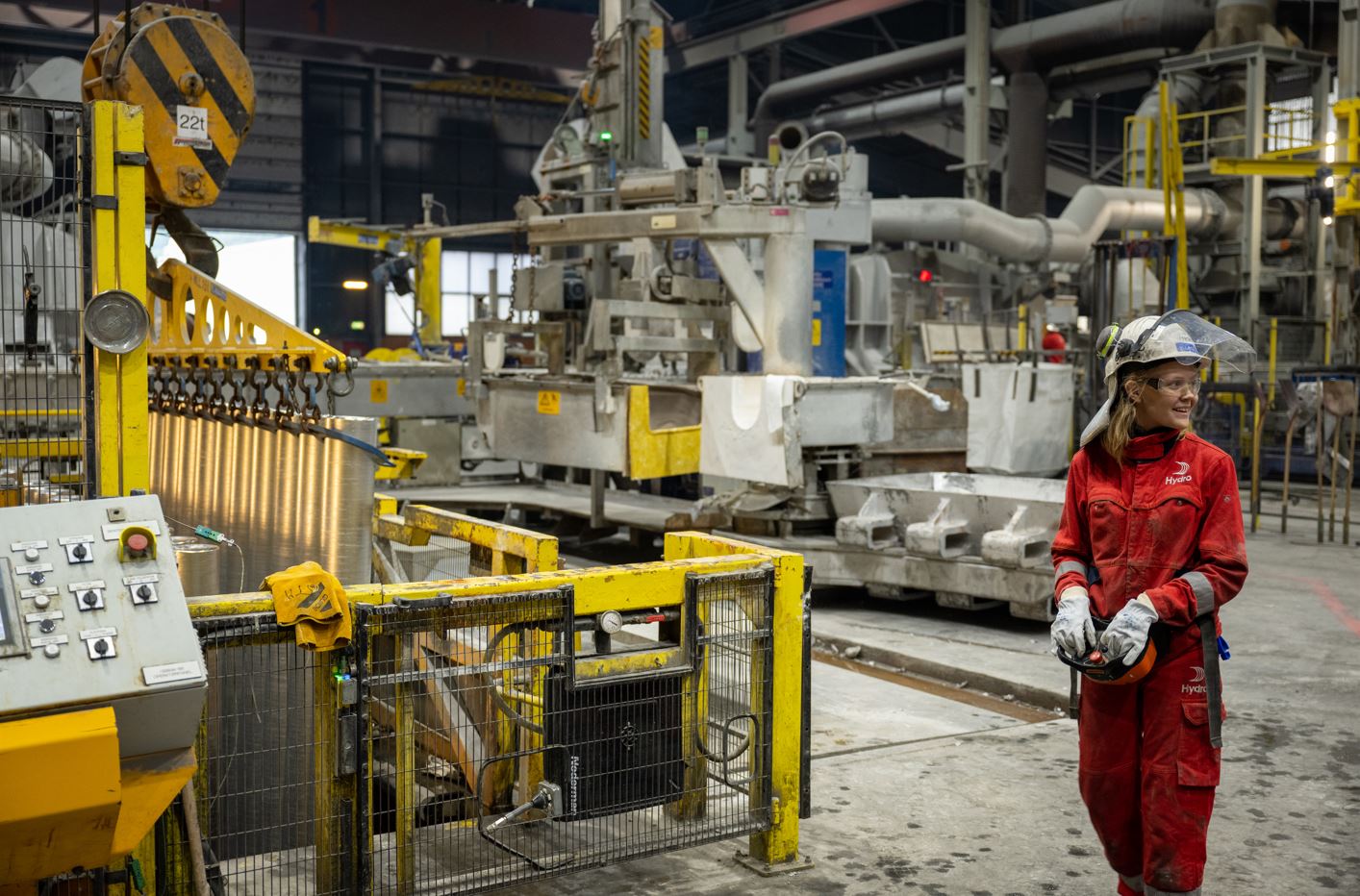 Hydro Husnes casthouse lifting billets from casting pit  Lena Landa Vetlækre, casthouse operator.