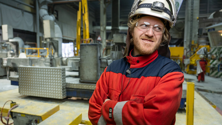 a man wearing a hard hat and protective glasses