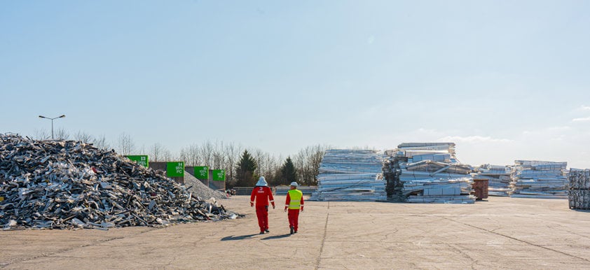 two people walking on a road