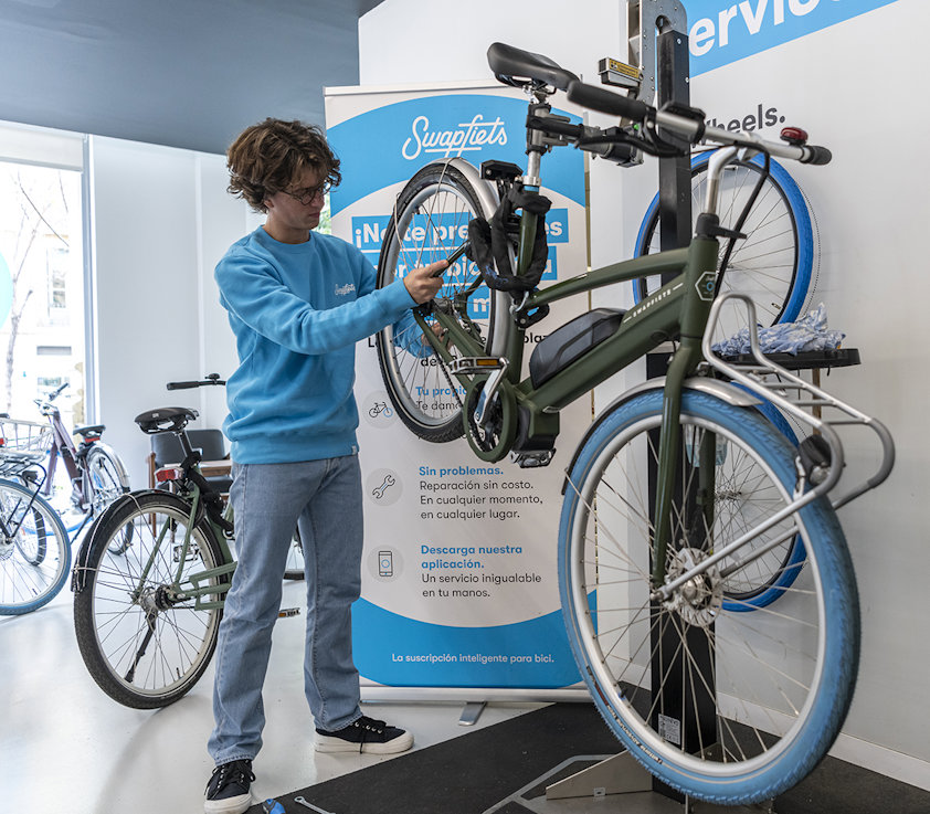 a person standing next to a bicycle