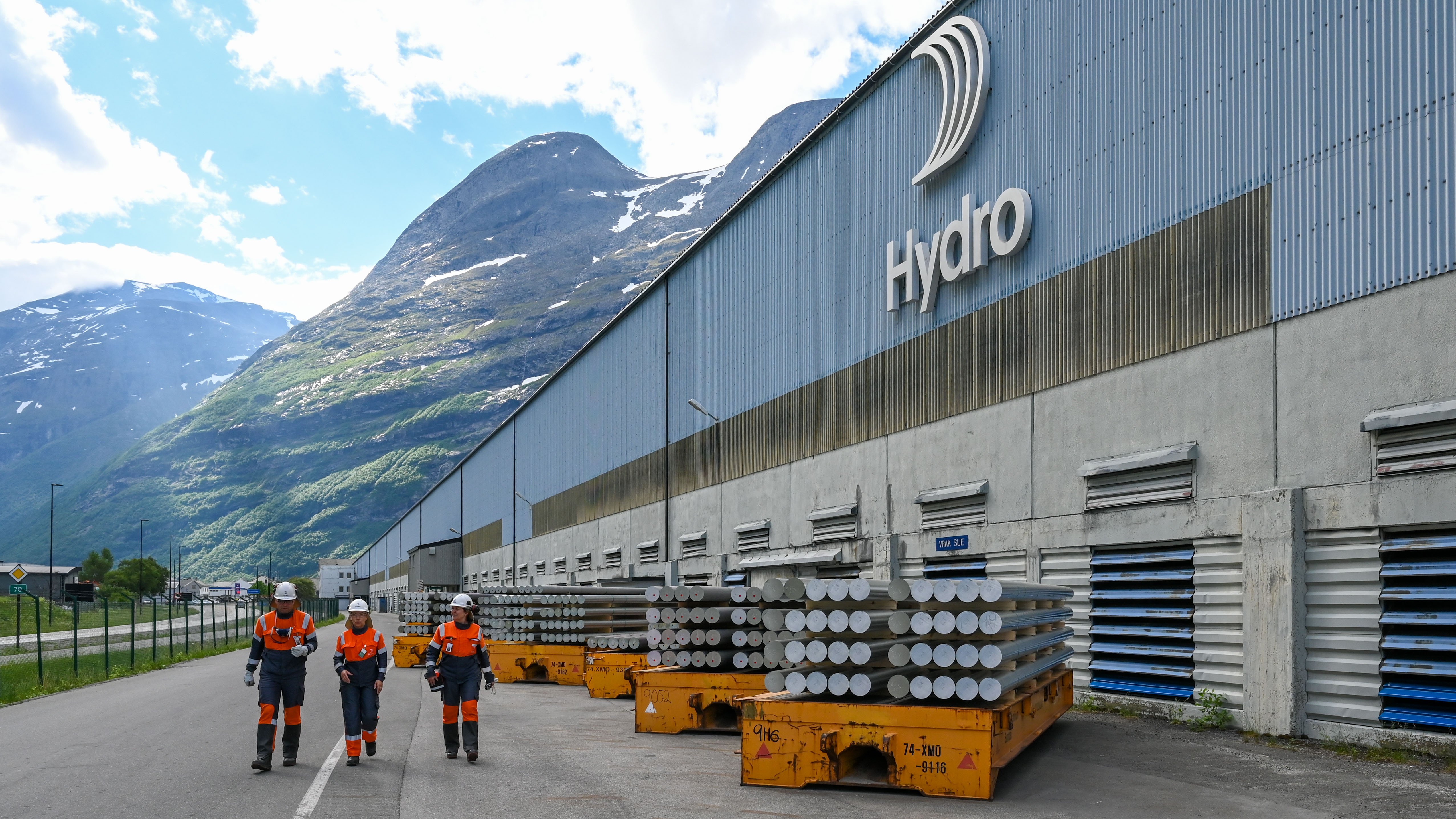 a group of people walking next to a large building