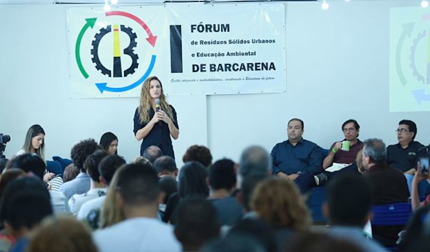 Woman talking to a group of people