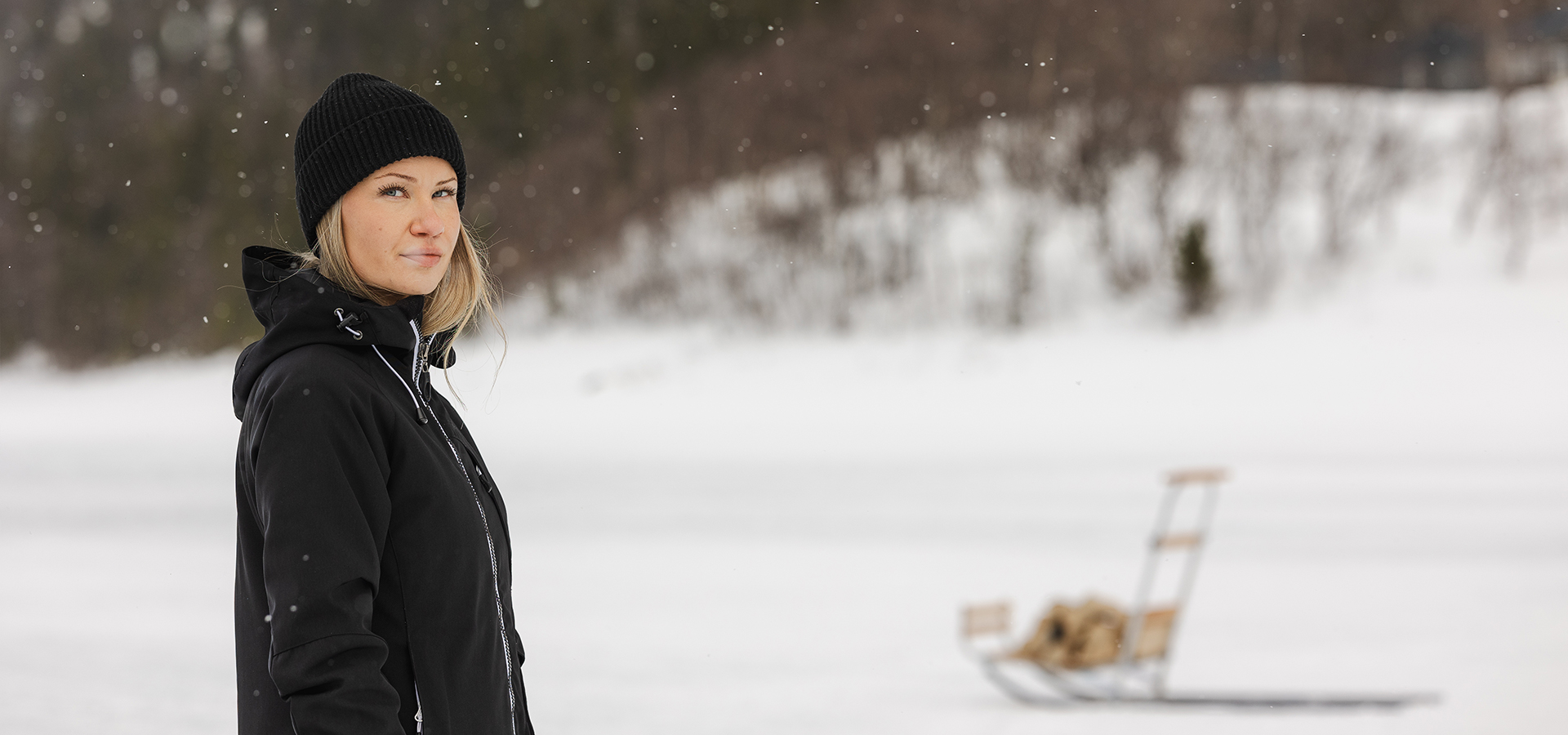 a woman standing in the snow