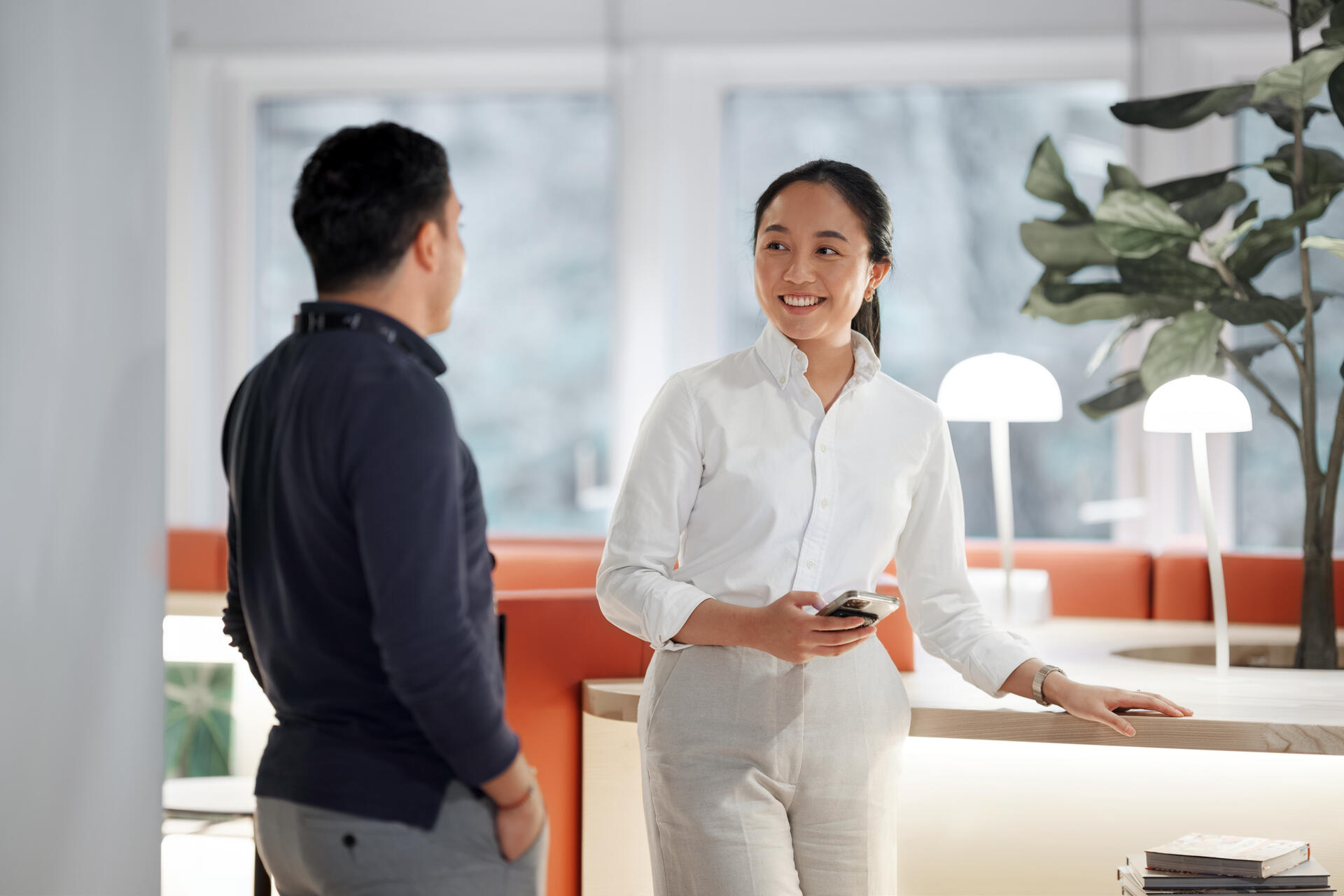 a woman talking to a man