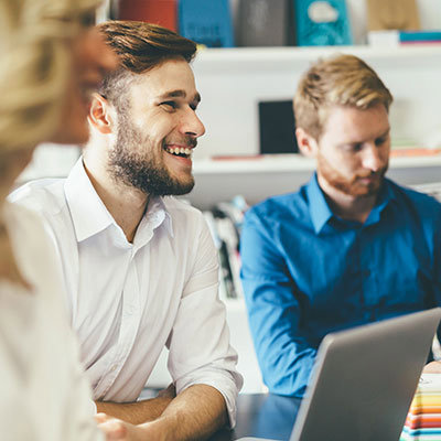 Two persons with laptop