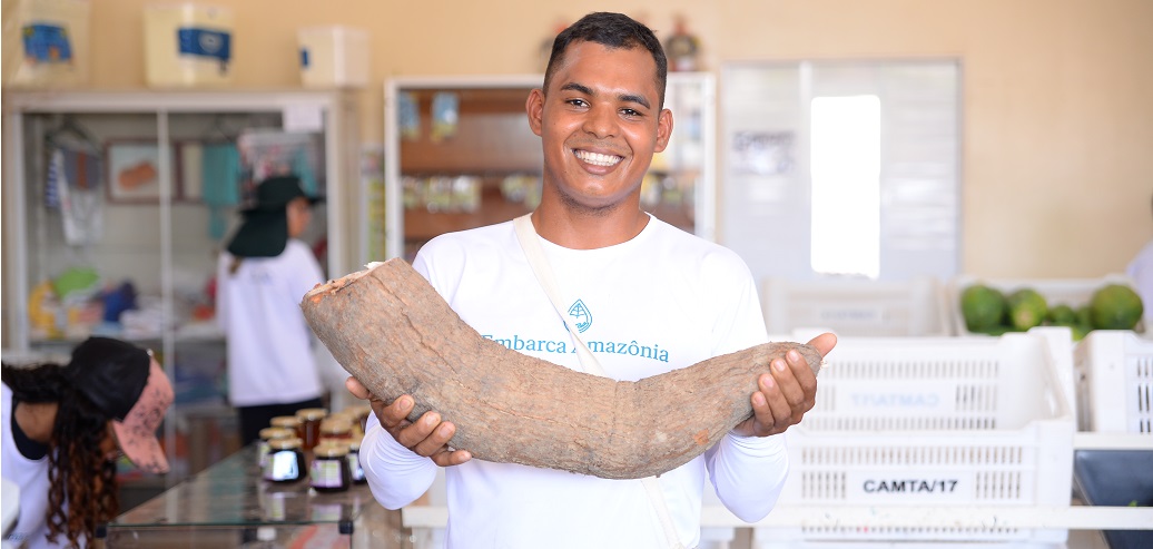 a man holding a large wooden board
