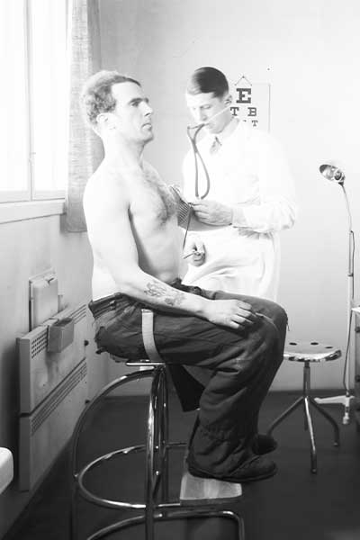 Patient is examined by the company doctor