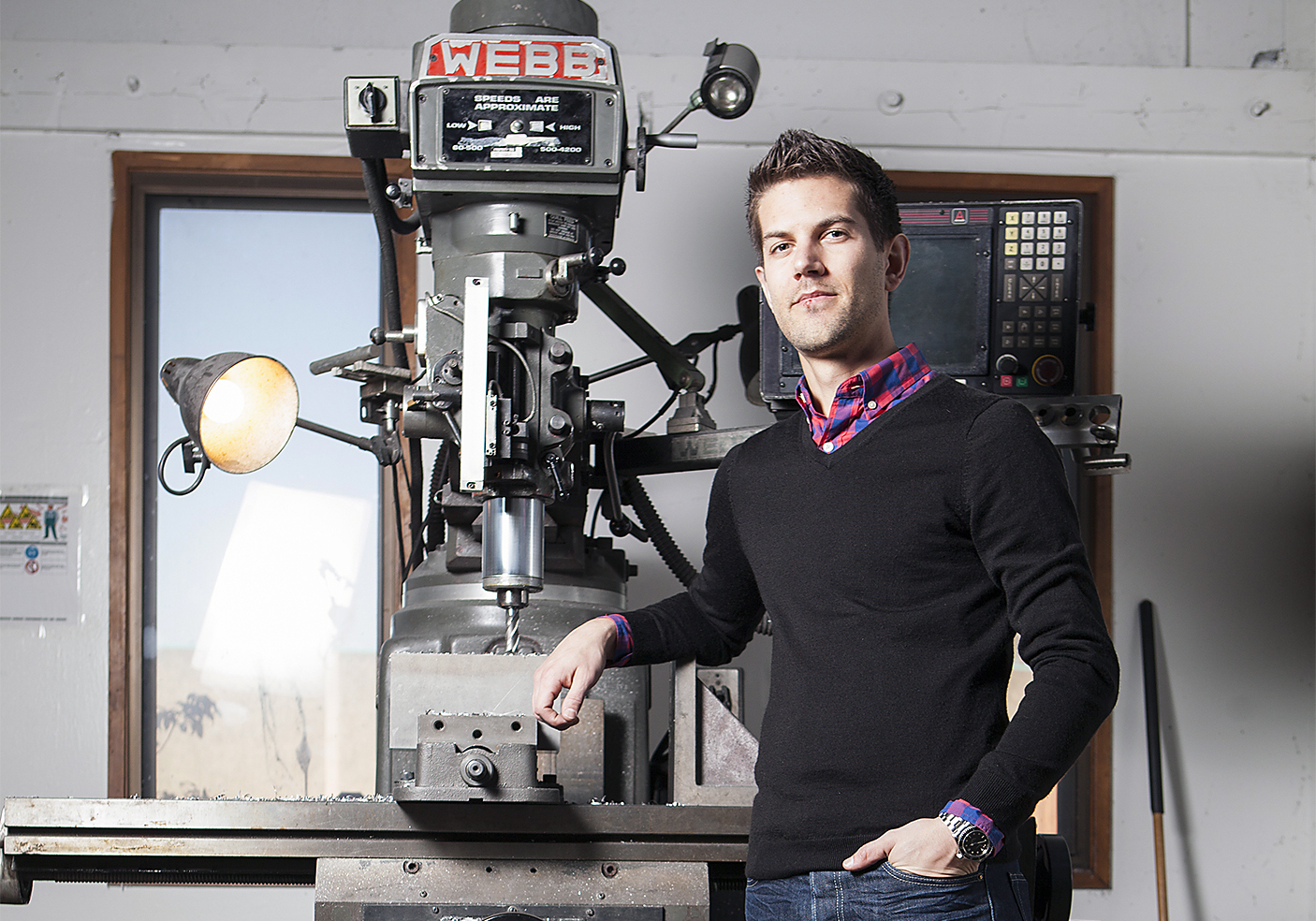 man posing with drilling machine