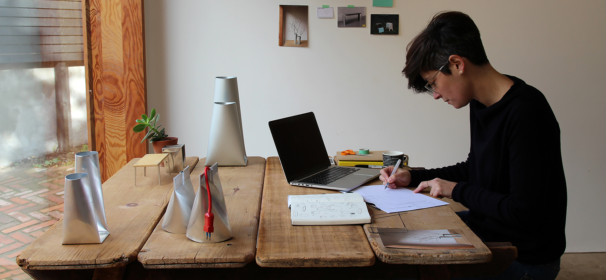 pers with laptop, pen and paper